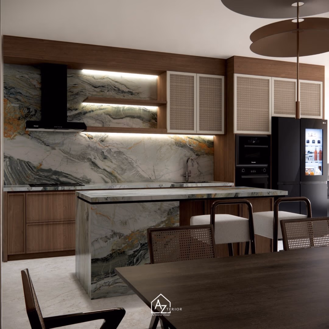 The full room — the island folding to the floor at both ends, cane-fronted uppers, and the dining table alongside
