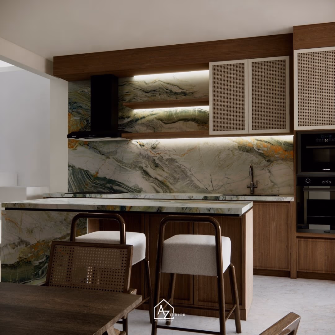 The cooking run under lit open shelves, the quartzite carrying straight from splashback to island top