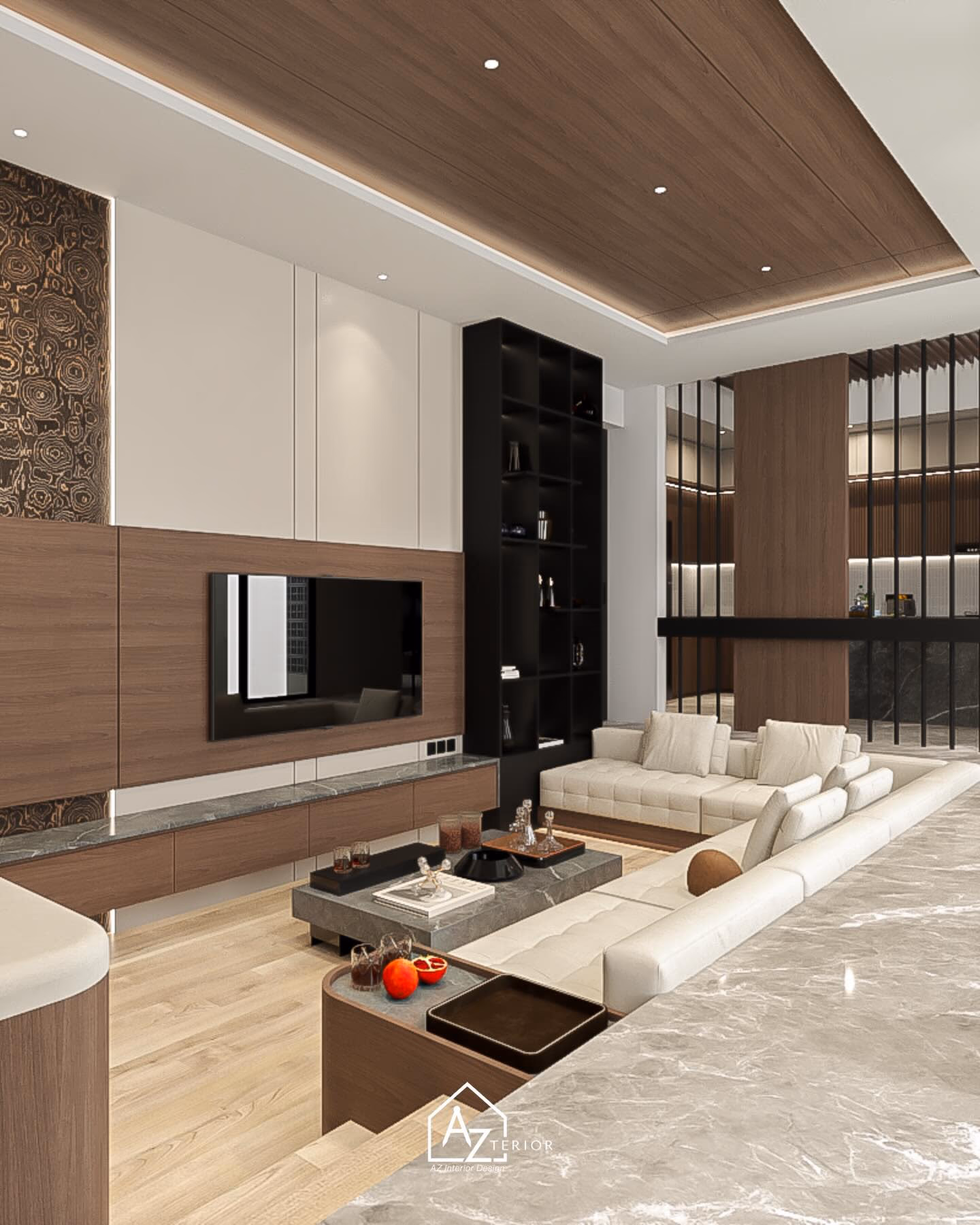 The living room from the kitchen side, the seating set below the marble floor level with the media wall beyond