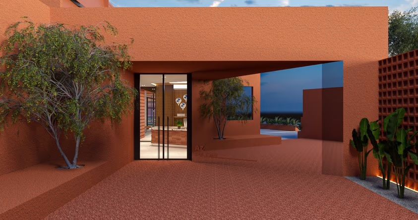 The entrance court, glazed doors set into a rendered terracotta wall beside a mature tree and a breeze-block screen