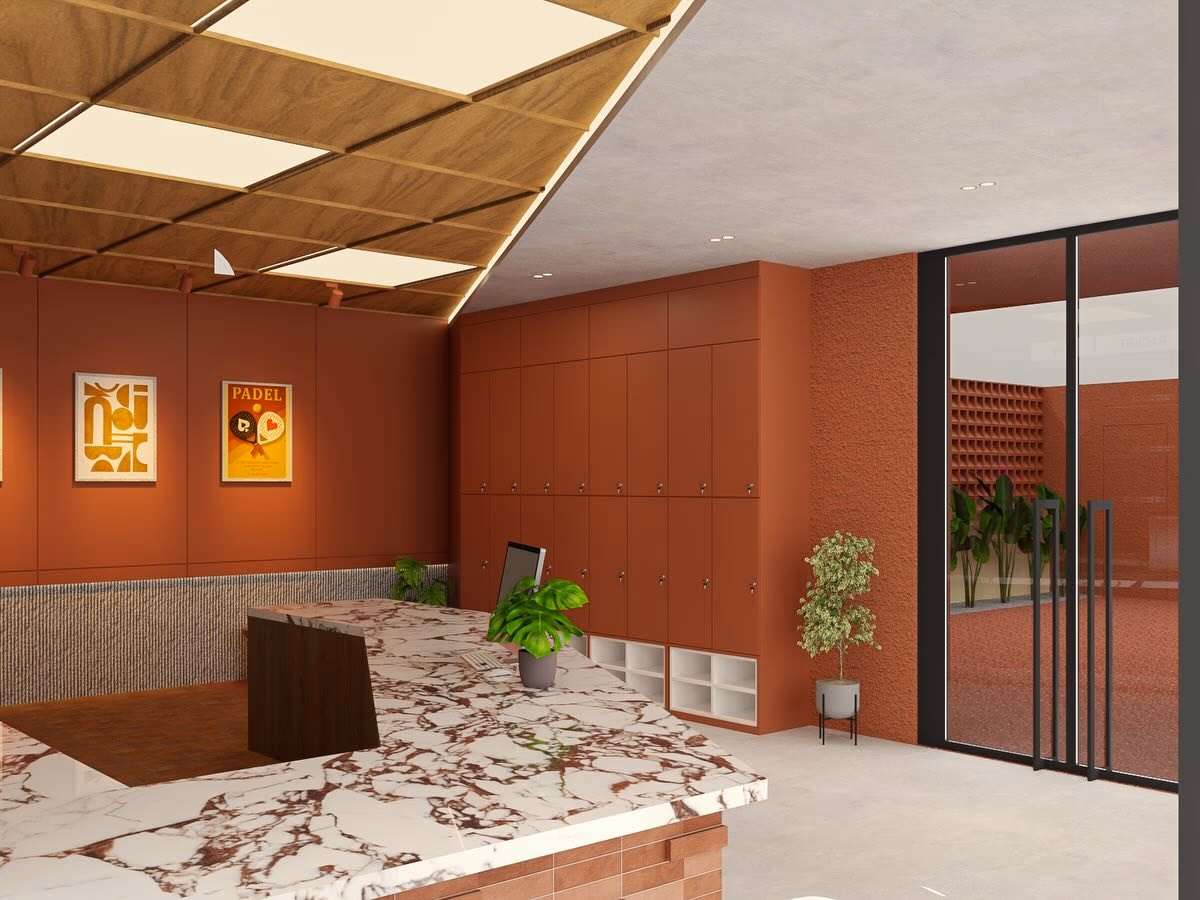 The reception desk in Calacatta Viola marble on a terracotta brick base, against a wall of terracotta lockers